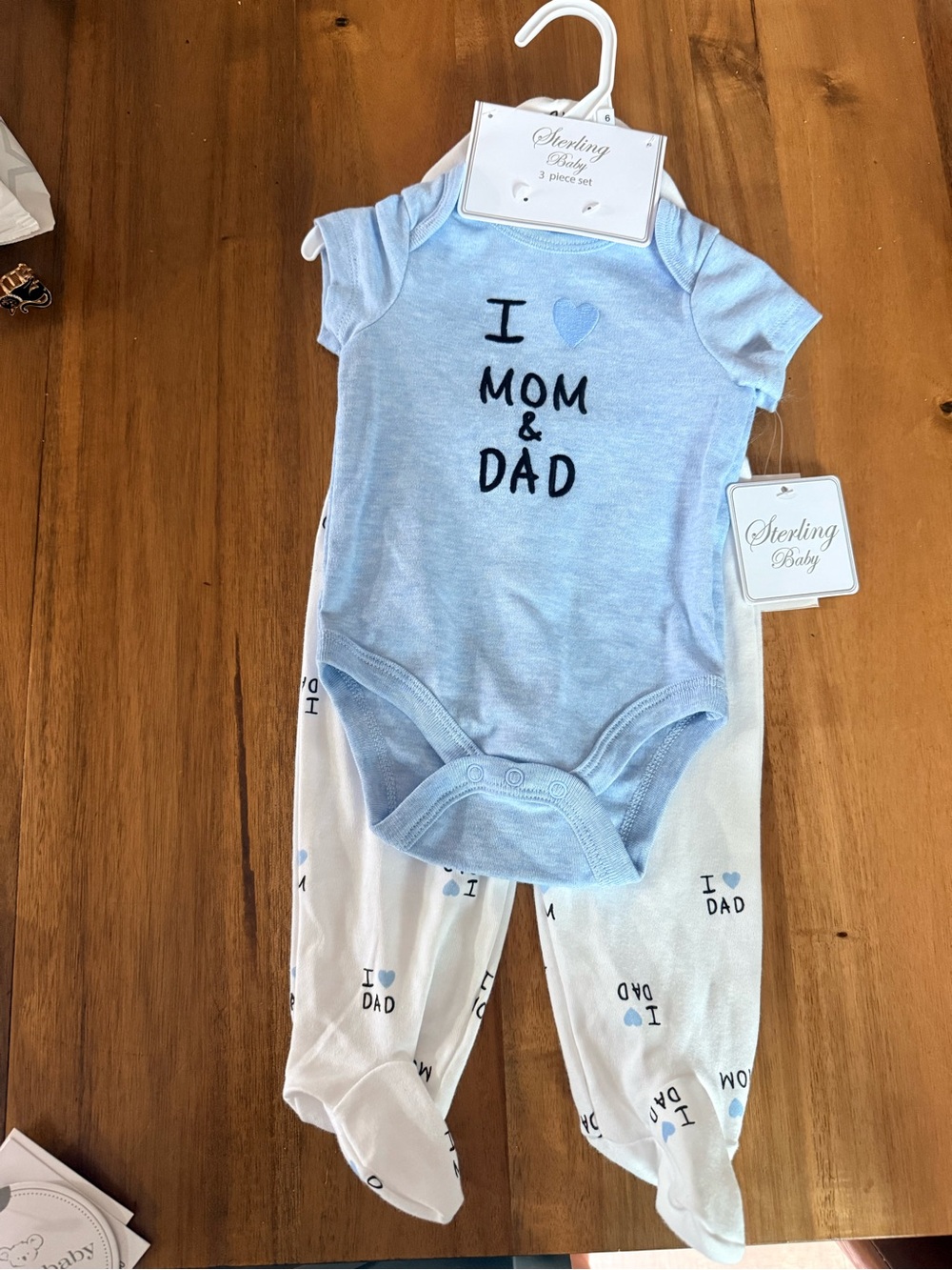 Blue onesie and pants set with hat